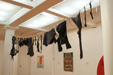 Christine Hellyar's City Clothesline, suspended between two columns, and on the back wall, works by Gavin Chilcott, Emily Karaka and Gretchen Albrecht.