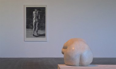 Sam Harrison: On the wall, Woman Walking Away, 2011, woodcut, 1425 x 895 mm; on plinth, Seated Woman, 2011, wax on plaster, 800 x 890 x 420 mm.