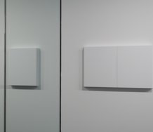 Matt Henry, User Friendly detail. On left (through glass) Untitled 500 x 400 (Titanium white), 2011. On right, Untitled 500x 800 (Titanium White), 2011, both acrylic gesso on linen, pine stretchers.