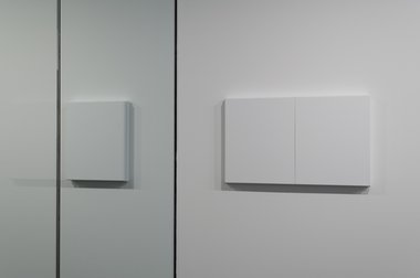 Matt Henry, User Friendly detail. On left (through glass) Untitled 500 x 400 (Titanium white), 2011. On right, Untitled 500x 800 (Titanium White), 2011, both acrylic gesso on linen, pine stretchers.