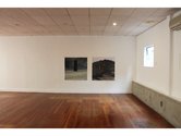 On wall, Layla Rudneva-McKay, Grey stones and blue velvet, and Yellow curtain, 2008, both c-type photographs. On right, concrete wall by Michael Parr,
