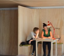 Newspaper Reading Club Daily, devised by Fiona Connor and Michala Paludan, at Split Fountain. The reader is Inger-Lisa Hurst, accompanied by the artist Michala Paludan..  Photo by Asumi Mizuo.