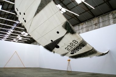 Lauren Brincat, Southeasterlies to the Doldrums, 2012 Nautical sail, adhesive nautical fabric, cassette tape 1400 x 600 x 15 cm
