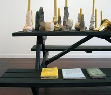 Detail of Richard Orjis installation, by quiet volcanoes. on the seat are painted ceramic 'books' by Tessa Laird.