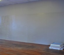 Bob van der Wal: clay brown + uracryl shield, 2012, Auckland City council uracryl shield, acrylic. On floor, untitled, 2012, X5, protective wrapping, primer, hardboard, pine, glue 