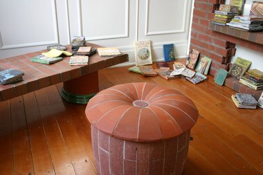 Reading Room (2012) at Objectspace Window Gallery: Tessa Laird, Clay Tablets, ceramic (earthenware and paperclay), ceramic paint, glaze; Peter Lange, Brick Bookcase, Table, Pouffe and Armchair, 2012, brick, timber, drainage tile. Courtesy of the artists 