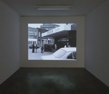 John Smith, Girl Chewing Gum, 1976, 16 mm transferred to HD video, 12 mins,B&W, sound. Courtesy of the artist and LUX, London. Photo: Sam Hartnett