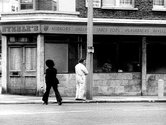 John Smith, Girl Chewing Gum, 1976, still, 16 mm transferred to HD video, 12 mins,B&W, sound. Courtesy of the artist and LUX, London.