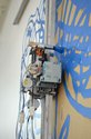 On wall, Simon Ingram, Tusalava Procedure, 2012 (detail) cardboard, oil paint, brush, Lego, aluminium, wood, electronics.