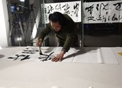 Yangjiang Group, Shu Tu Tong Gui (Calligraphy and Scratching Leading to the Same Thing), 2013, partipatpry community event, tea residue, calligraphy.