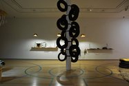 Xin Cheng, Propositions, 2013 (installation detail). Vinyl, felted wool, corrugated cardboard, native edible plants, potting mix, bamboo, fabric, plastic, used tires, tiedowns, Paul Hogan’s tire tree idea, used inner bicycle inner tubes and bicycle chains