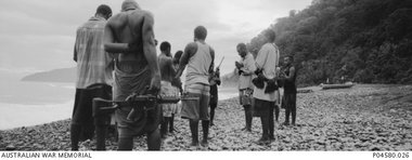 Photograph on page 4 of The Black Islands. Bohane's note reads '"Warlord" Harold Keke (centre, praying) and his GLF (Guadalcanal Liberation Front) guerrillas pray on a beach before patrolling, along the Weathercoast, Guadalcanal, Solomon Islands 2013.'