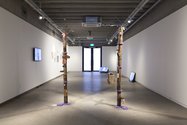 In foreground, Jacquelyn Greenbank, Squatch Poles, 2015, wood, leather, embroidery. Photo: Daniela Aebli