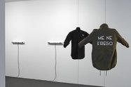 Deborah Rundle, Political Colours, 2018 black shirt with printed text, military patch and officers’ stars, khaki jacket with printed text, mannequin torso commissioned by Te Tuhi, Auckland  Optimism of the Will, 2018 two fluorescent tubes and vinyl text