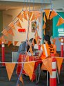 PᾹNiA!, Pakuranga Customs House/Attitude Arrival Lounge, 2019, rope bunting, concrete temporary fence feet, furniture, bollards, passports, stamps, inkpads, stationery, fixings, overall dimensions variable. Photo: Sam Hartnett