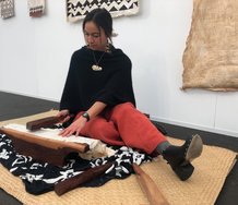 Nikau Hindin pounds aute, as her works are installed at Te Uru. Image from the website of Maori TV, May 2019. 