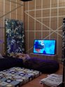 Interior of Yonel Watene's Wharenui (first home), 2019, cardboard, newspaper, house paint, oil paint, mattresses, various objects, commissioned by Te Tuhi Auckland.  Also Yonel Watene, Immortal Dance , 2018 -2019, HD video. Photo: Sam Hartnett 