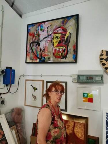 Annie Wilson with a painting by Ercan Cairns, Miranda Farm Gallery.