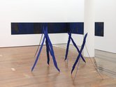 On the floor, 4 Blue Tripods, 2021, iron-oxide stained and painted ply installation, dimensions variable.