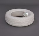 Steve Carr, A Tyre with a Glass Sphere, 2022, cast plaster and glass, 610 x 610 x 190mm.