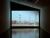 Installation view of Susan Norrie's Spheres of Influence film being screened at Two Rooms. Single channel video, 26.44 minutes
