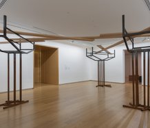 Ana Iti's installation, A resilient heart like the manawa, 2024, kauri timber, steel, rust, audio field recordings. At Auckland Art Gallery Toi o Tamaki. 