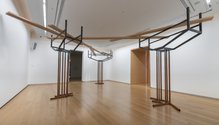 Ana Iti's installation, A resilient heart like the manawa, 2024, kauri timber, steel, rust, audio field recordings. At Auckland Art Gallery Toi o Tamaki. 
