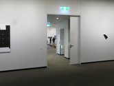 Installation view of Billy Apple, Gallery Abstracts, Potton Family Gallery with partially opened door, corridor and Nelson Suter Art Society Gallery, 2018.