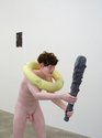 Ronnie van Hout, Figure with Club, 2024, painted resin, wig, 1250 x 500 x 405 mm