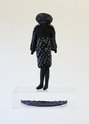 Te Maari, (E) Mrs Jimmy Curtis, Tāringi-Starling of E 4th St, 2024, felt, wool/synthetic fibres (knitted elements), cotton (embroidery), custom acrylic stage, 32 x 13 x 5 cm (figure), 32.8 x 25 x 14 cm (stage)