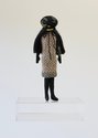 Te Maari, (E) Raynor Bambino, Kōhihi of Little Italy, 2024, felt, wool/mohair/synthetic fibres (knitted/crocheted elements), cotton (embroidery), custom acrylic stage 32 x 16 x 5 cm (figure), 32.8 x 25 x 14 cm (stage)