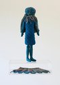 Te Maari (E) Sammy Haupapa, Kōtarepopo of Davenport, 2024, felt, wool/synthetic fibres (knitted elements), cotton (embroidery), custom acrylic stage, 33 x 11 x 5 cm (figure), 32.8 x 25 x 14 cm (stage)