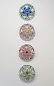Judy Darragh, Green, Red, Pink and Blue Hubcaps, 2024, plastic, acrylic, each 450 x 450 mm